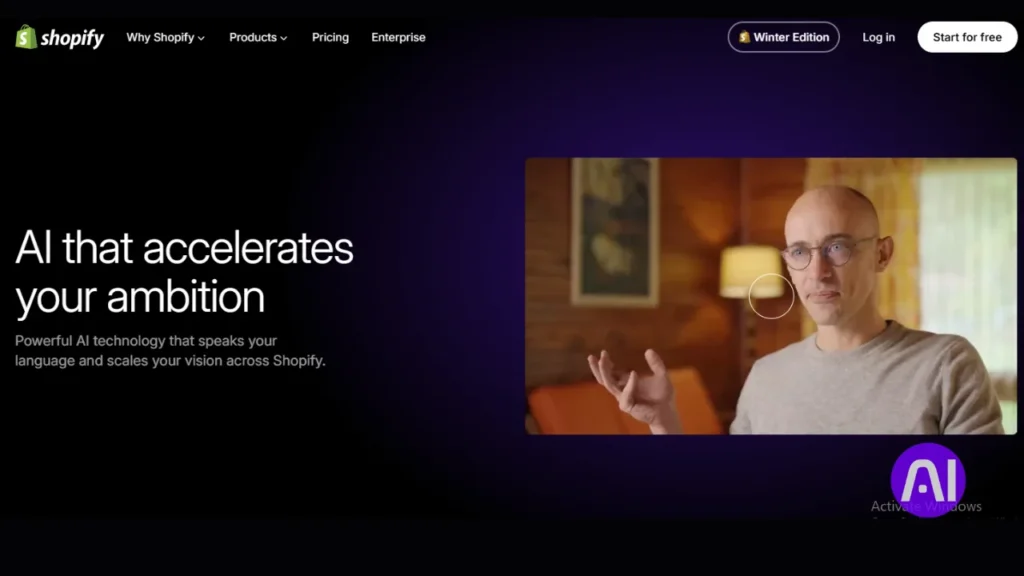 A screenshot of the Shopify website with the text "AI that accelerates your ambition," featuring a man speaking in a video.